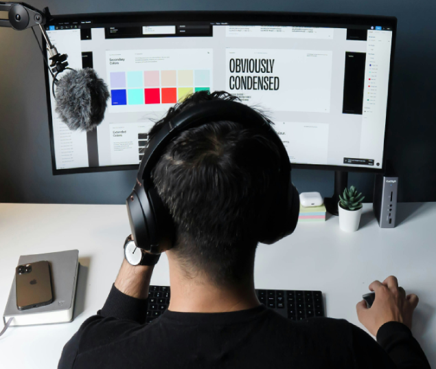 A boy working on system and hearing music