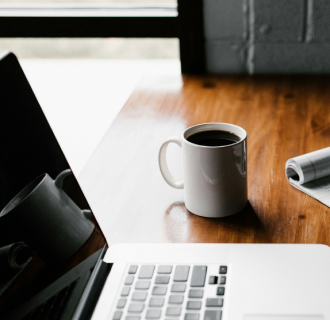 Laptop with a cup of coffee
