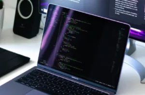 Laptop screen with coding