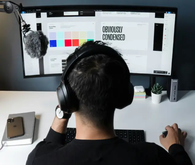 A boy working on system and hearing music